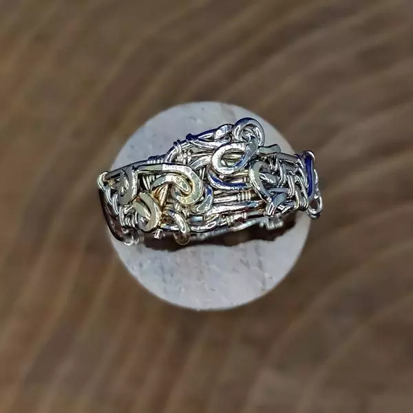Anello uomo in rame intrecciato